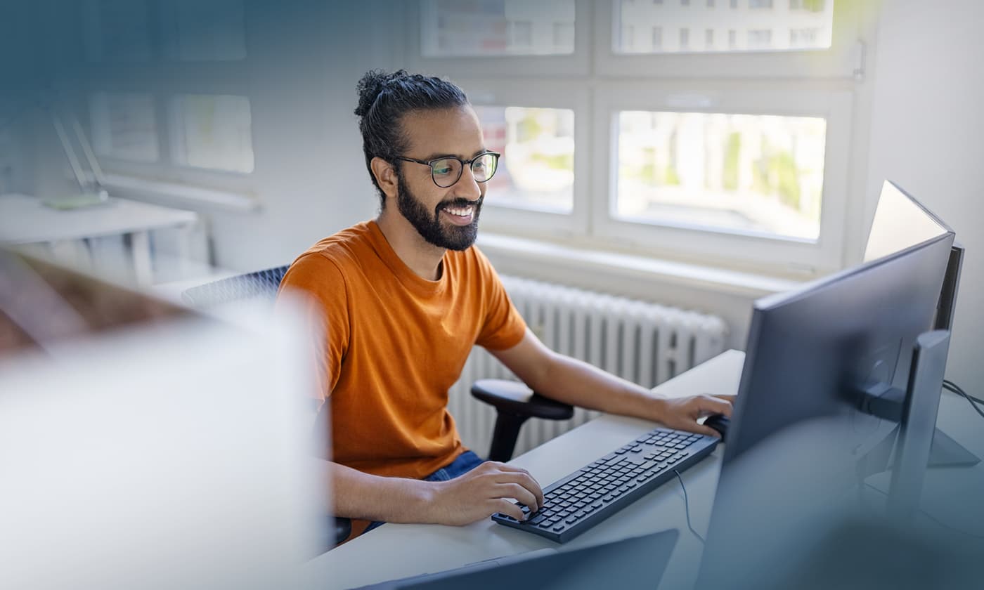 person looking at computer monitor